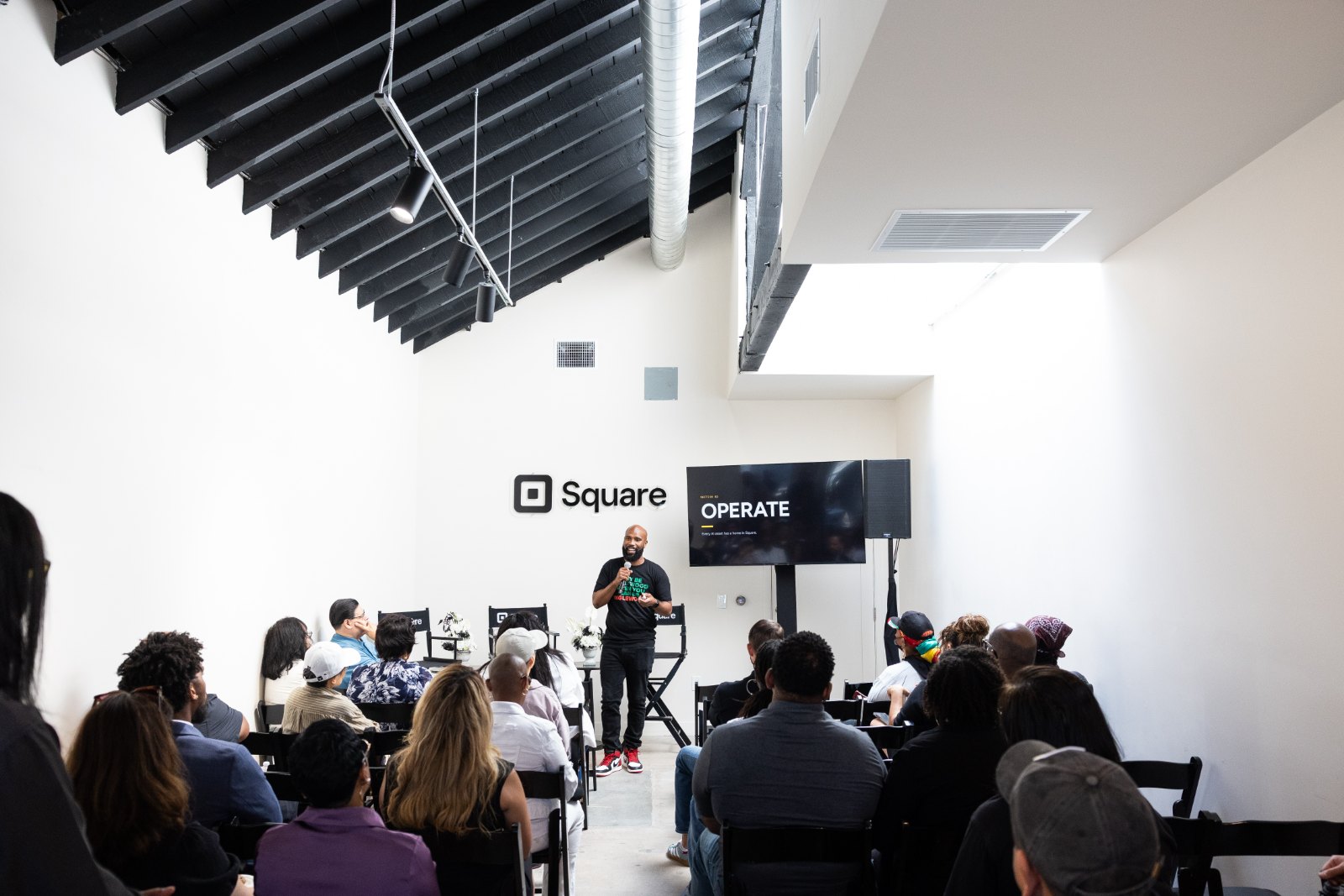 Terell Johnson speaking at Square LA in front of a slide reading Operate